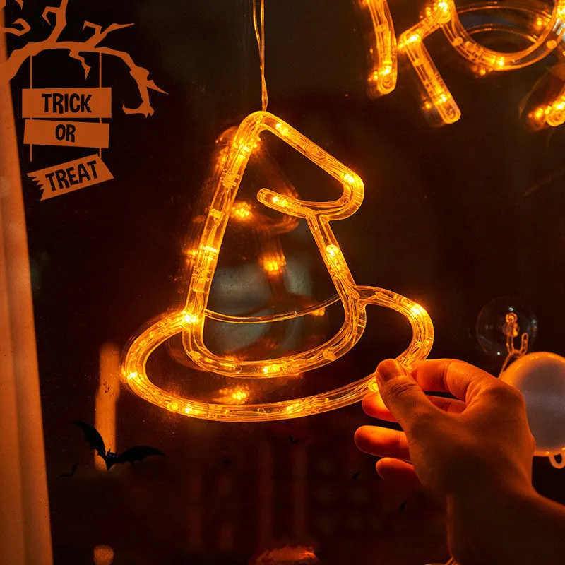 Halloween LED window lights with suction cups showing ghost, spider, and pumpkin decorations