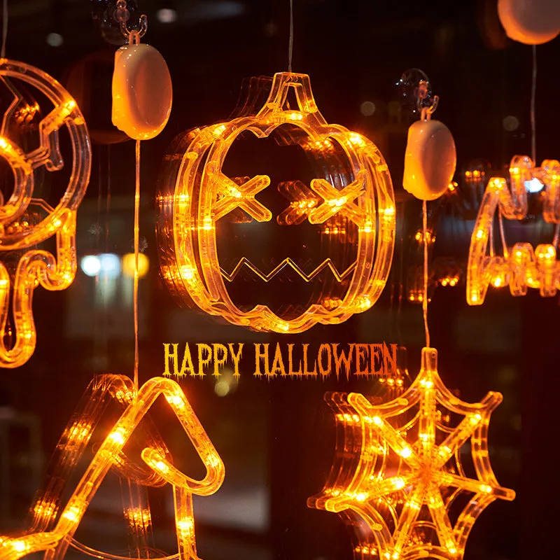 Halloween LED window lights with suction cups showing ghost, spider, and pumpkin decorations