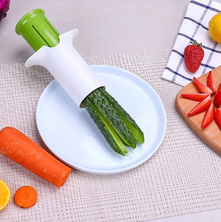White vegetable cutter with stainless steel blades for slicing cucumbers carrots and strawberries