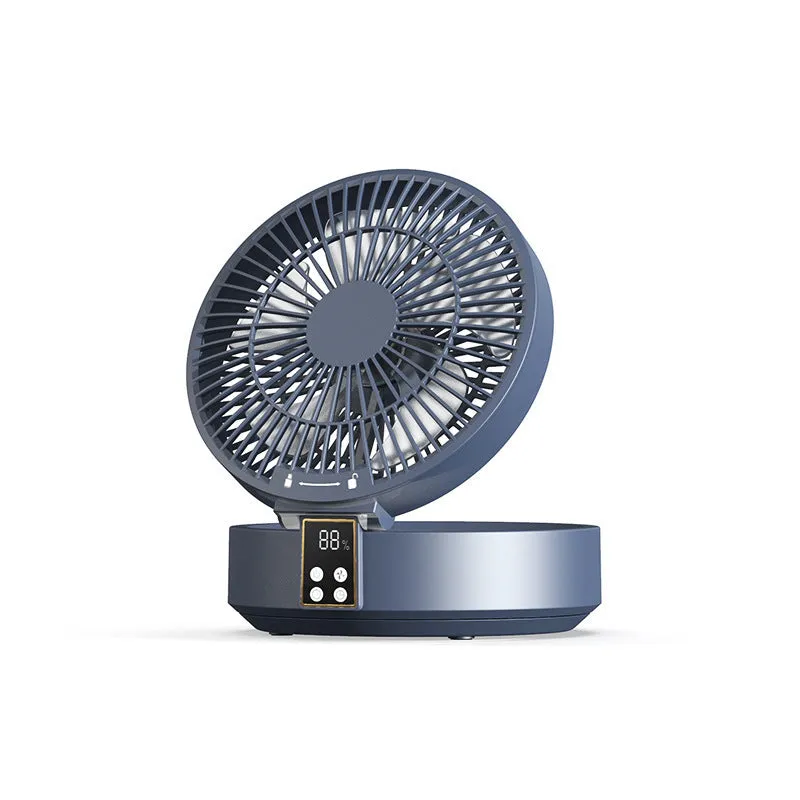 White portable folding electric fan with night light and remote control on a desk