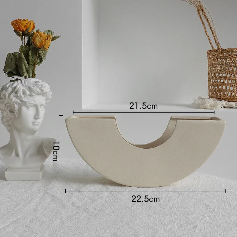 Unglazed matte ceramic vase for dry flower arrangements with textured finish