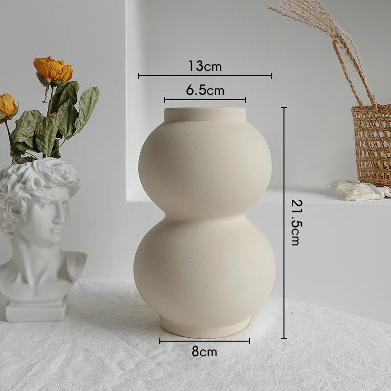 Unglazed matte ceramic vase for dry flower arrangements with textured finish