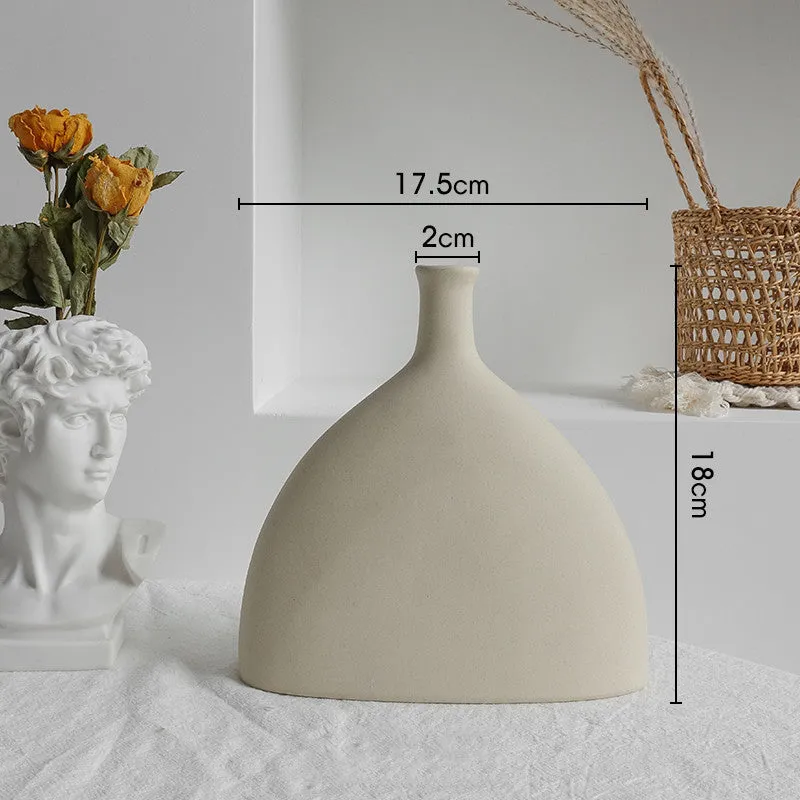 Unglazed matte ceramic vase for dry flower arrangements with textured finish