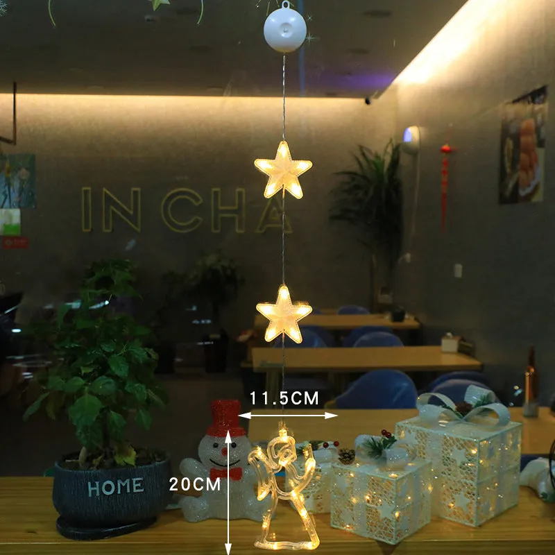Christmas LED window light with suction cups showing deer, bell, and tree designs