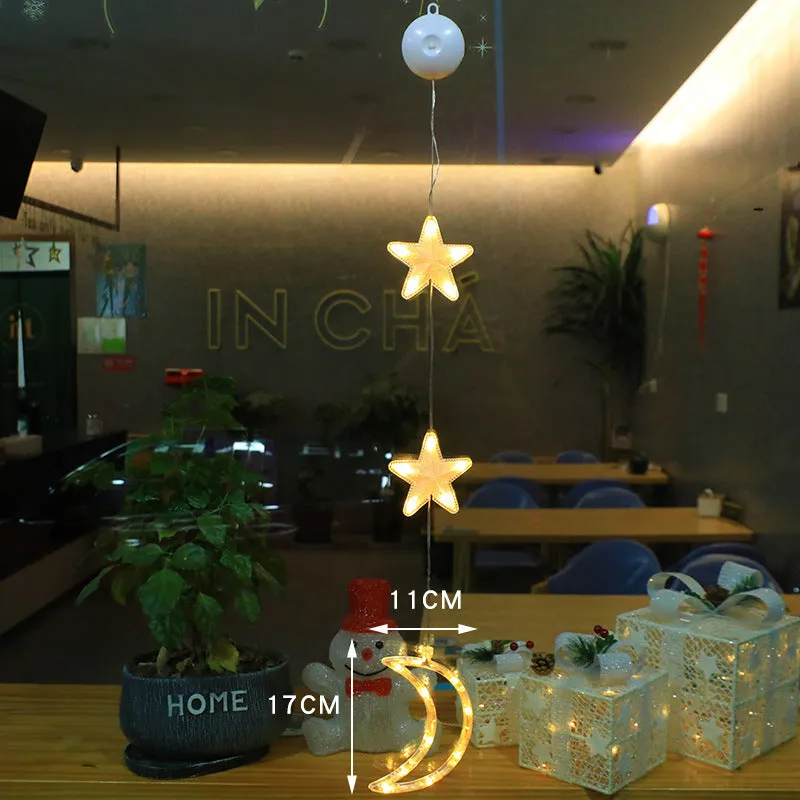 Christmas LED window light with suction cups showing deer, bell, and tree designs