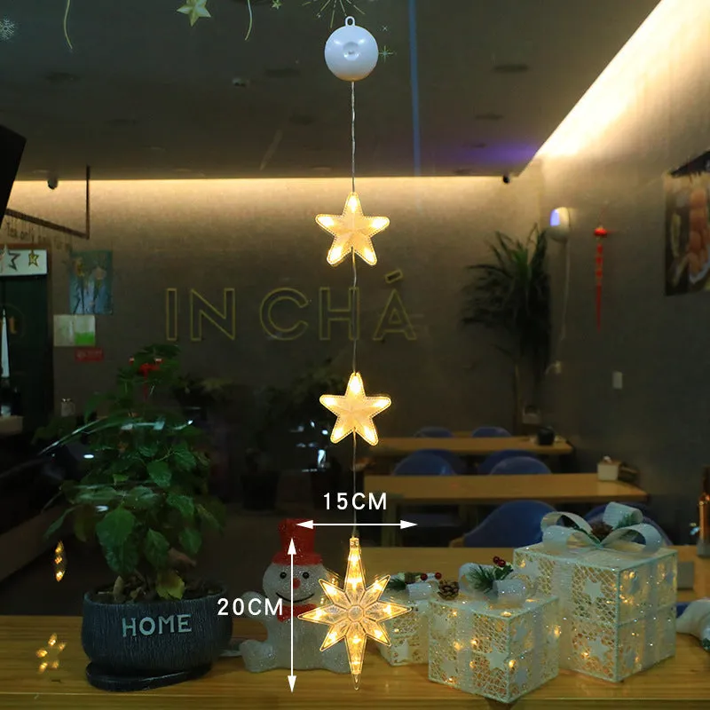 Christmas LED window light with suction cups showing deer, bell, and tree designs