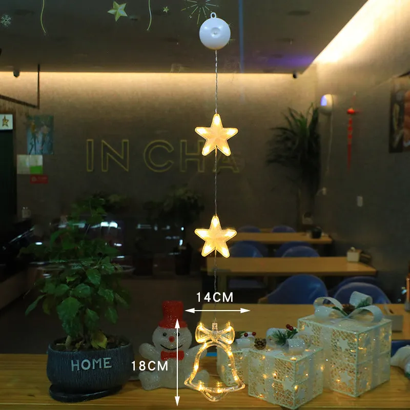 Christmas LED window light with suction cups showing deer, bell, and tree designs