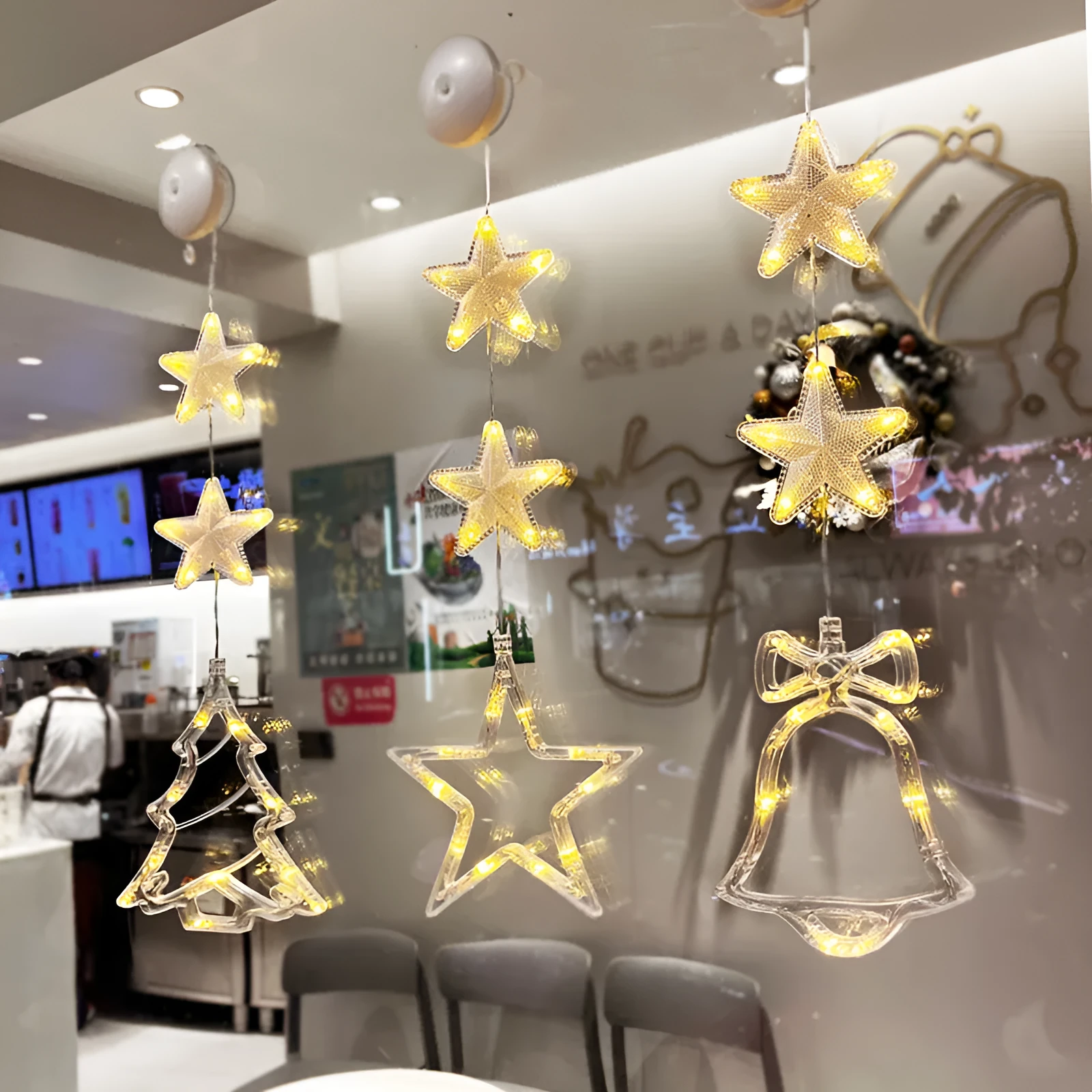 Christmas LED window light with suction cups showing deer, bell, and tree designs