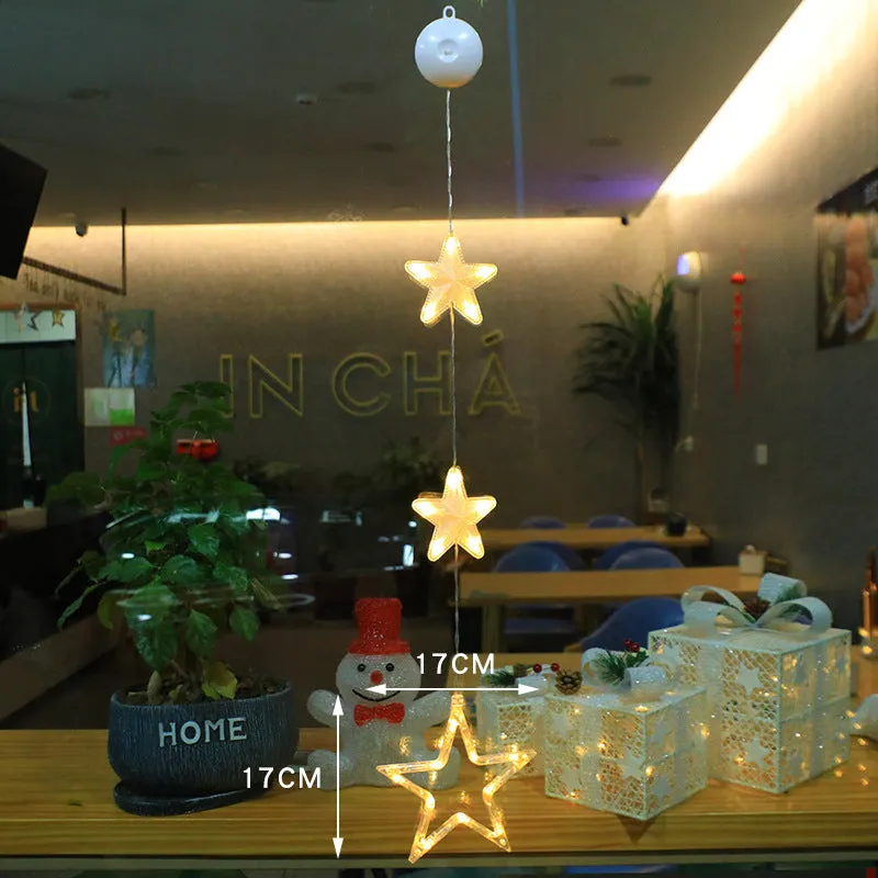 Christmas LED window light with suction cups showing deer, bell, and tree designs