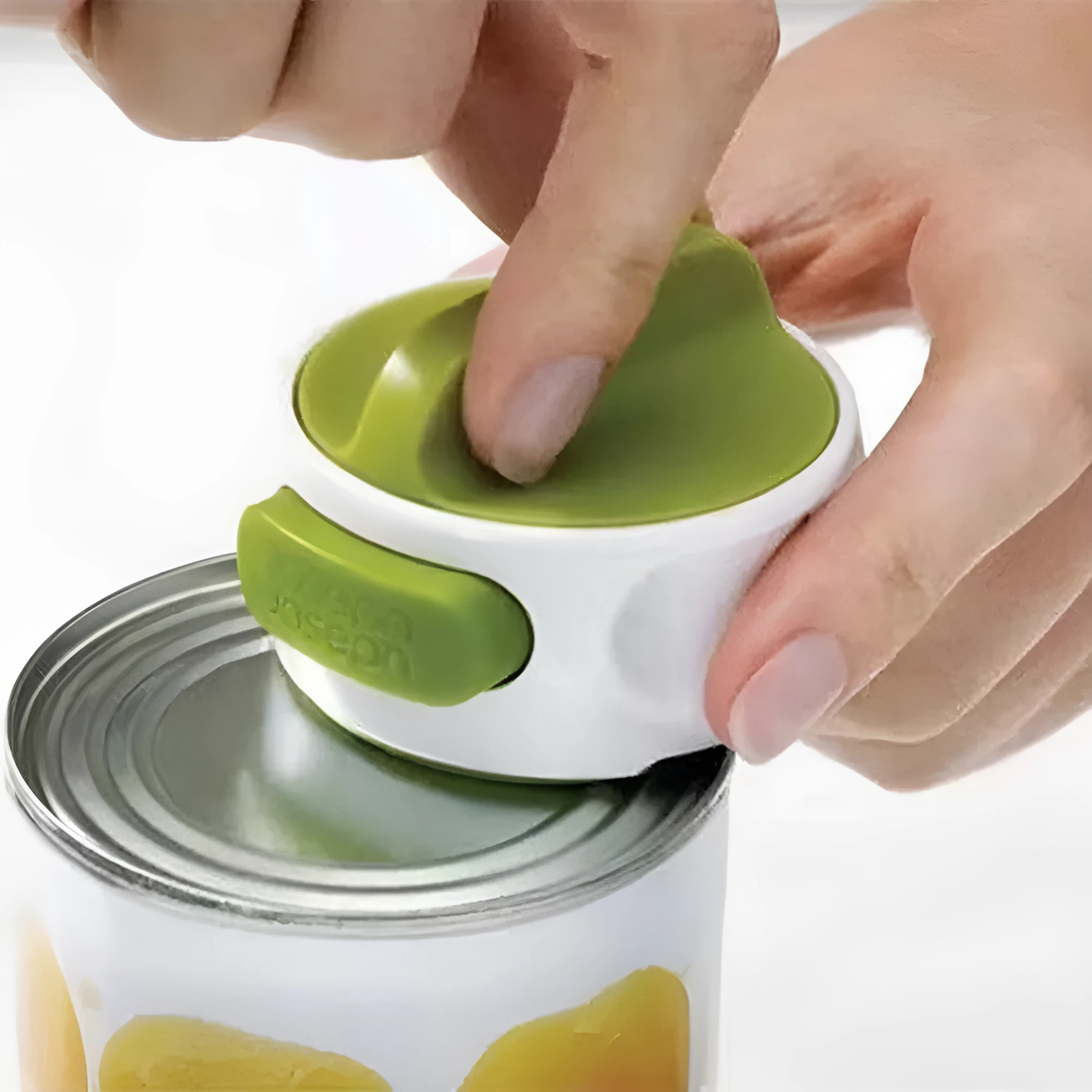 Green stainless steel lid opener kitchen gadget showing dimensions and screw mechanism