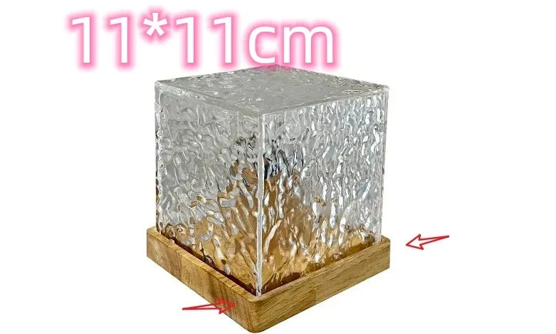 USB rechargeable crystal table lamp projecting blue water ripple light pattern on wall.