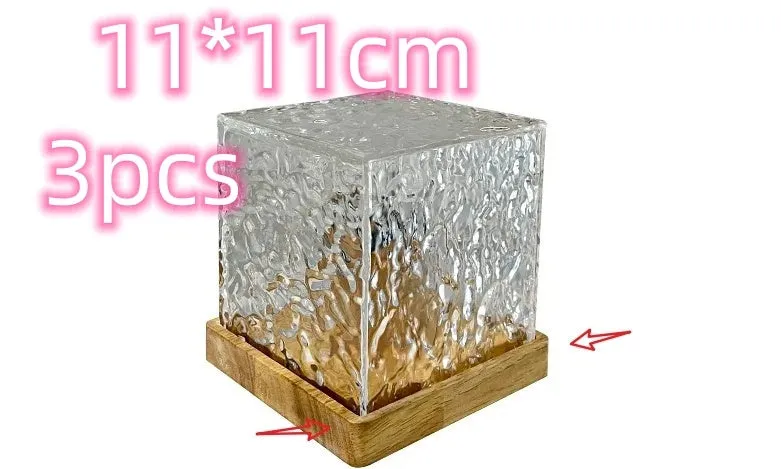 USB rechargeable crystal table lamp projecting blue water ripple light pattern on wall.