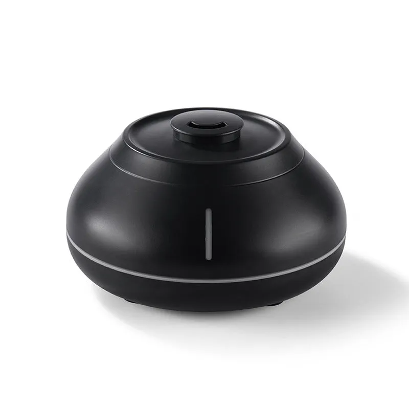 Desktop aroma diffuser humidifier with colourful flame effect in black resin finish