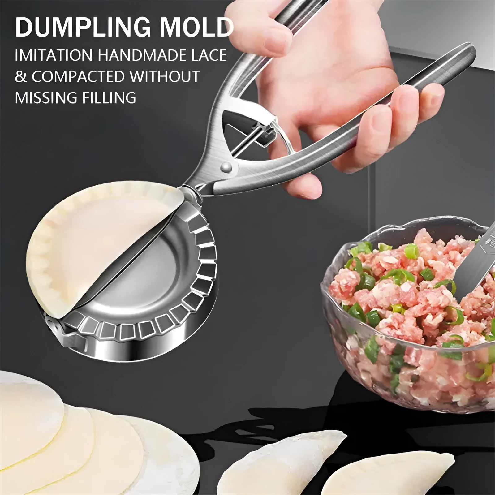 Silver stainless steel manual dumpling press tool on kitchen work surface