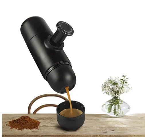 Compact black portable manual coffee machine for espresso, shown with dimensions 6cm by 17.5cm