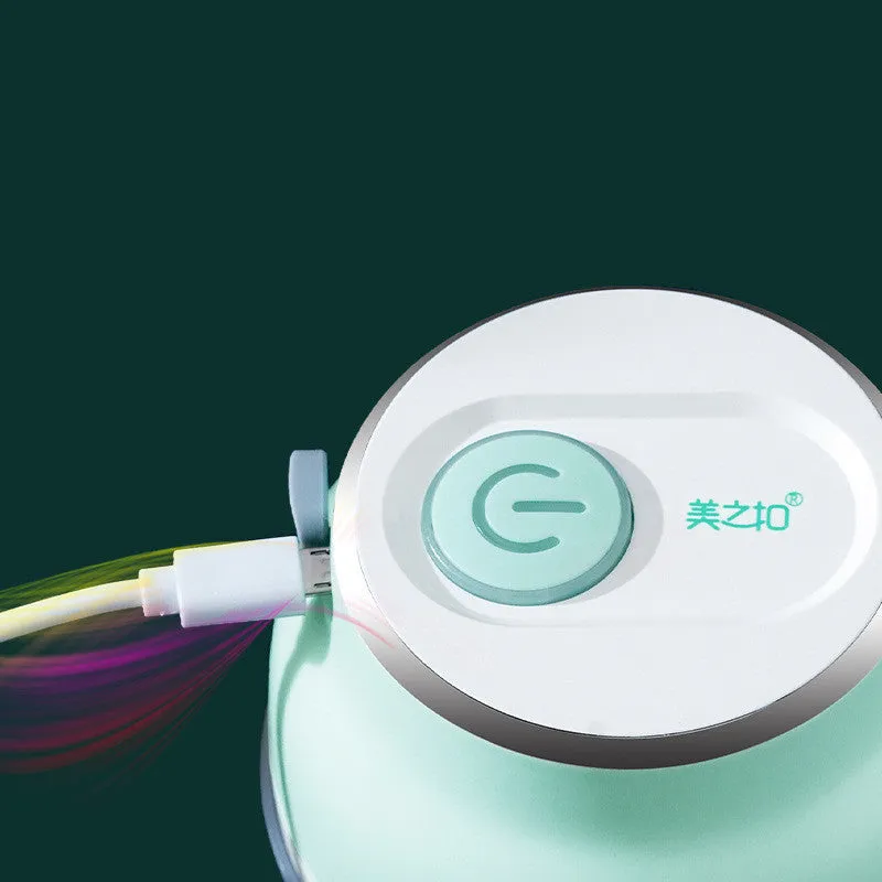Portable USB rechargeable electric food chopper with transparent cup and stainless steel blade.