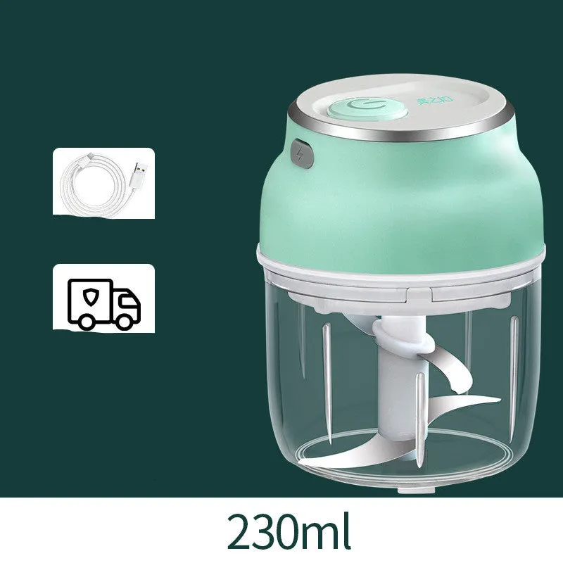 Portable USB rechargeable electric food chopper with transparent cup and stainless steel blade.
