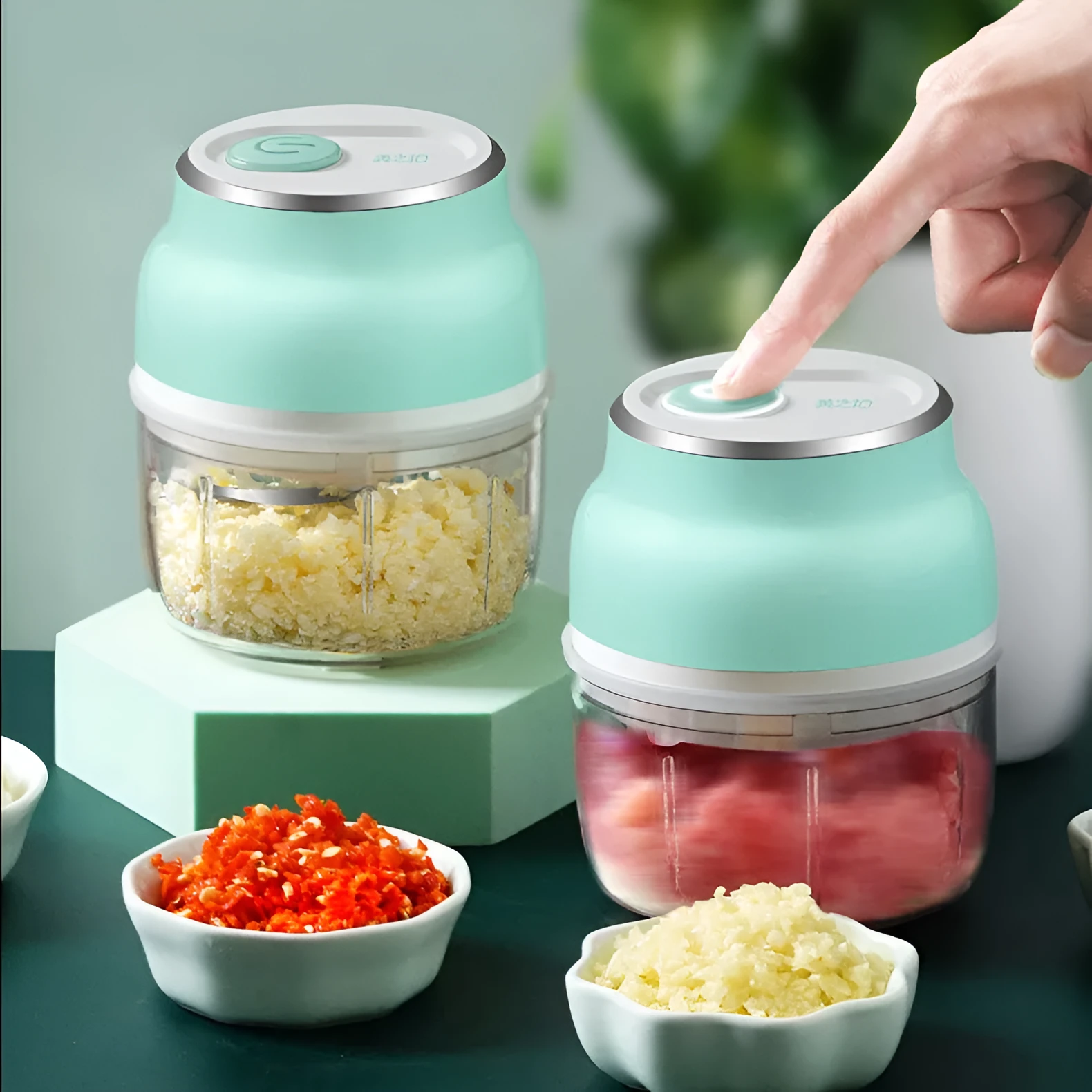 Portable USB rechargeable electric food chopper with transparent cup and stainless steel blade.