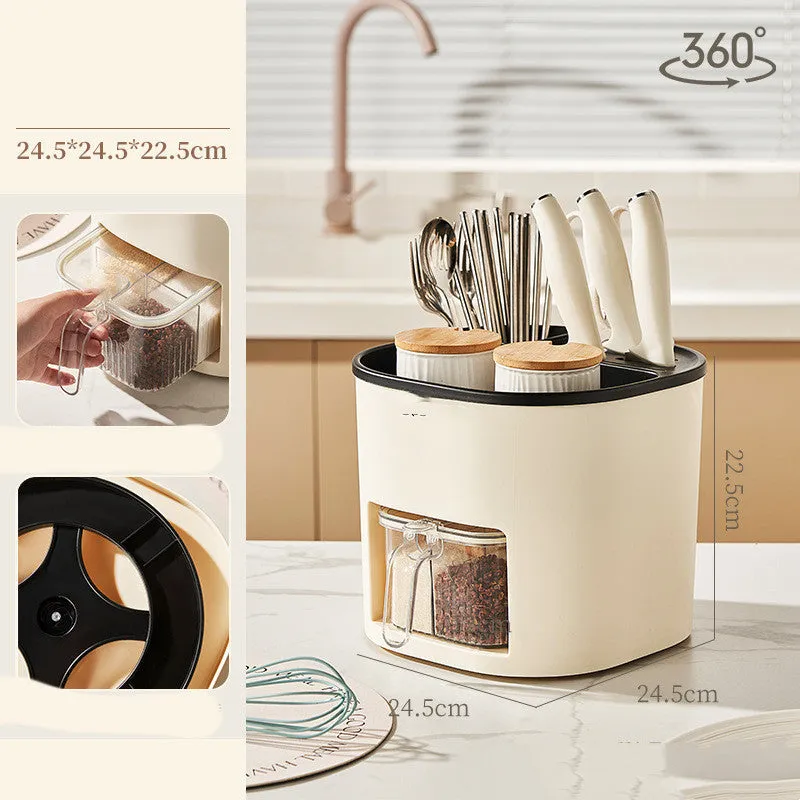 White rotating kitchen storage bucket with four-compartment spice box lid next to cutlery.