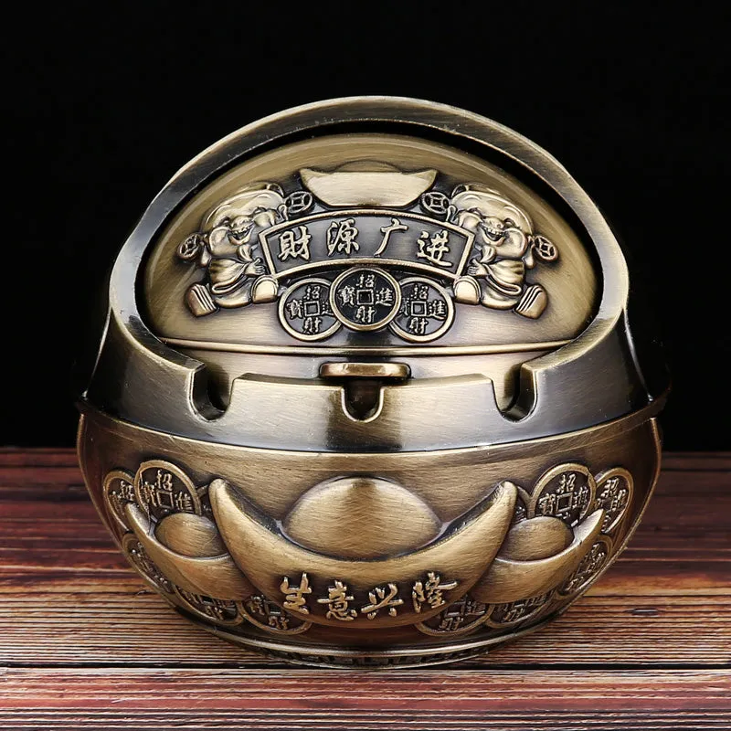 Bronze alloy ashtray with decorative fortune tree design and smoke extinguishing slot.