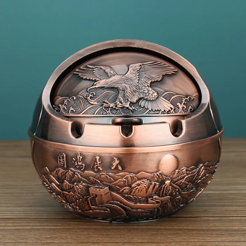 Bronze alloy ashtray with decorative fortune tree design and smoke extinguishing slot.