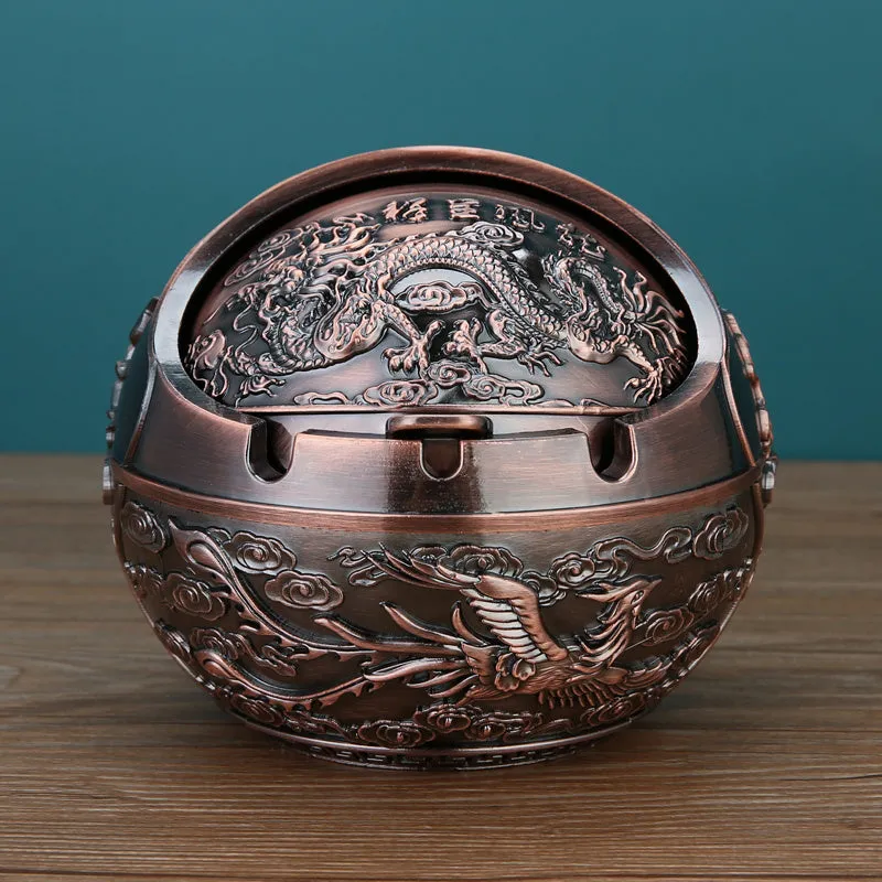 Bronze alloy ashtray with decorative fortune tree design and smoke extinguishing slot.