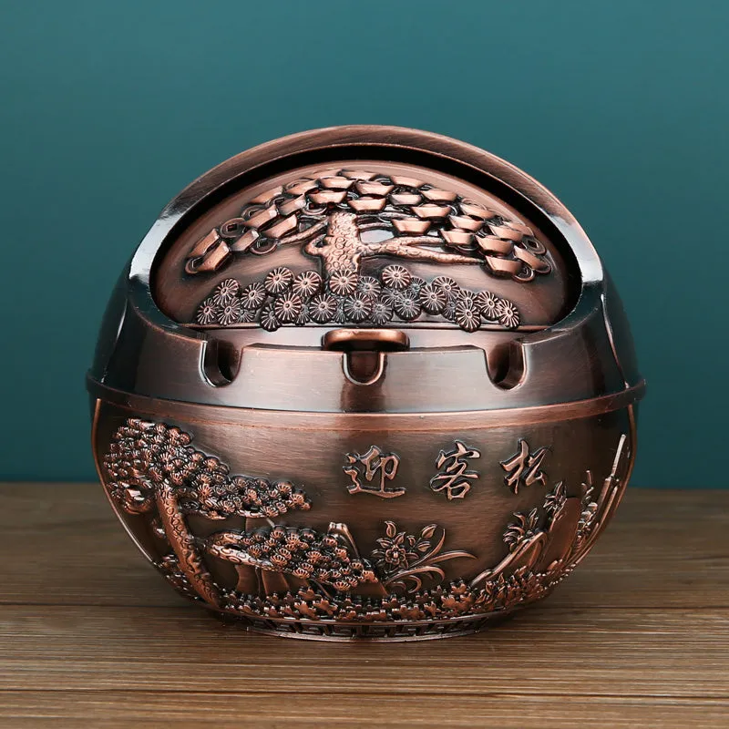 Bronze alloy ashtray with decorative fortune tree design and smoke extinguishing slot.