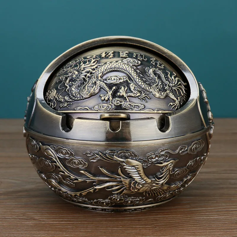 Bronze alloy ashtray with decorative fortune tree design and smoke extinguishing slot.