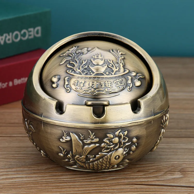 Bronze alloy ashtray with decorative fortune tree design and smoke extinguishing slot.