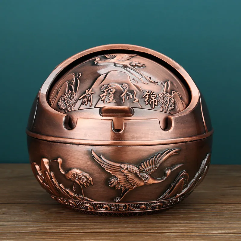 Bronze alloy ashtray with decorative fortune tree design and smoke extinguishing slot.