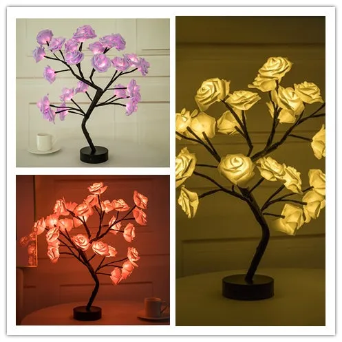 White and red rose flower shaped USB battery LED table lamp with warm white light on a table.