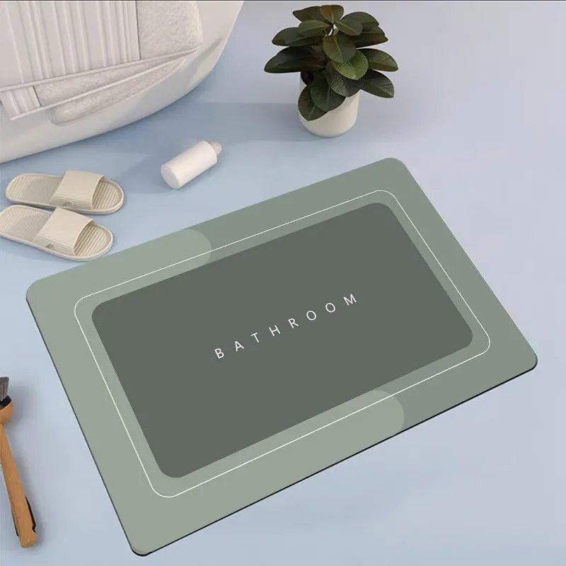 Natural rubber quick-drying bathroom floor mat in blue, available in oval and rectangular shapes.