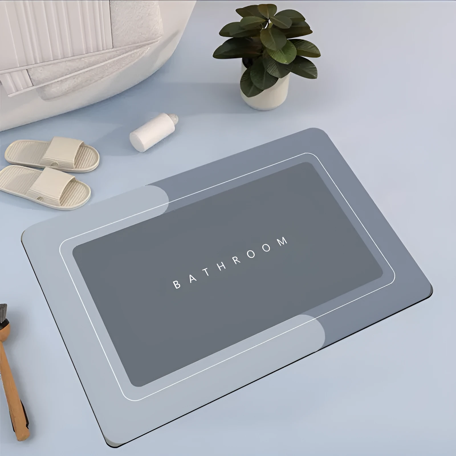 Natural rubber quick-drying bathroom floor mat in blue, available in oval and rectangular shapes.