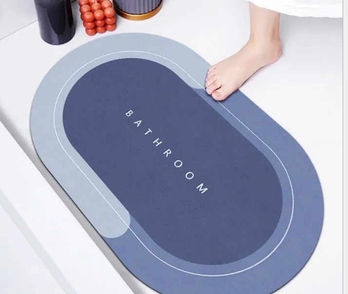 Natural rubber quick-drying bathroom floor mat in blue, available in oval and rectangular shapes.