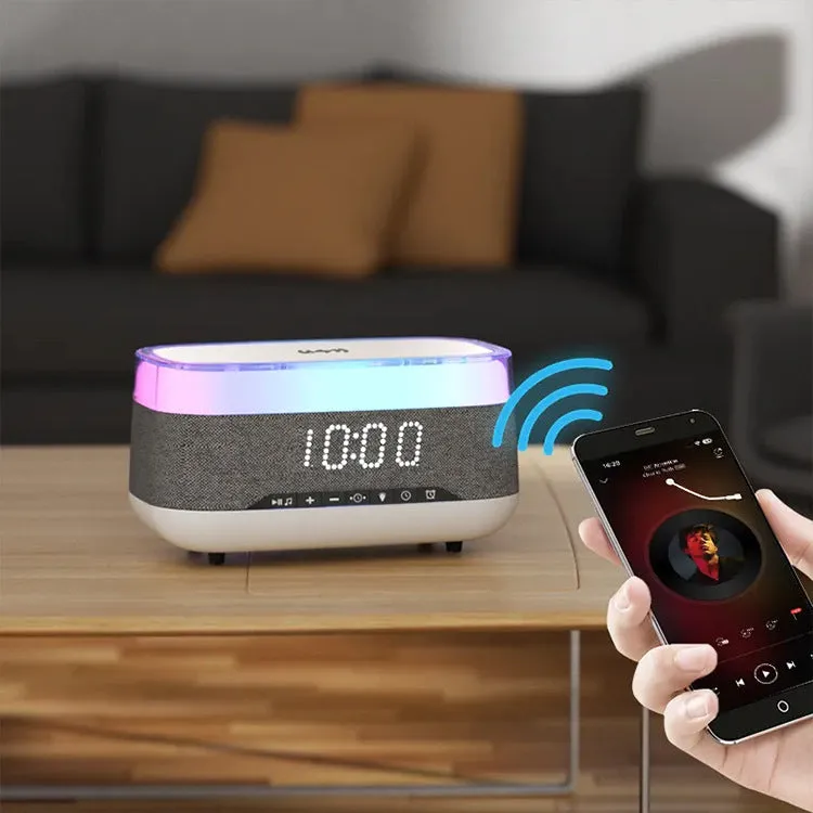 White multifunctional alarm clock with Bluetooth speaker and wireless charging pad on a bedside table.