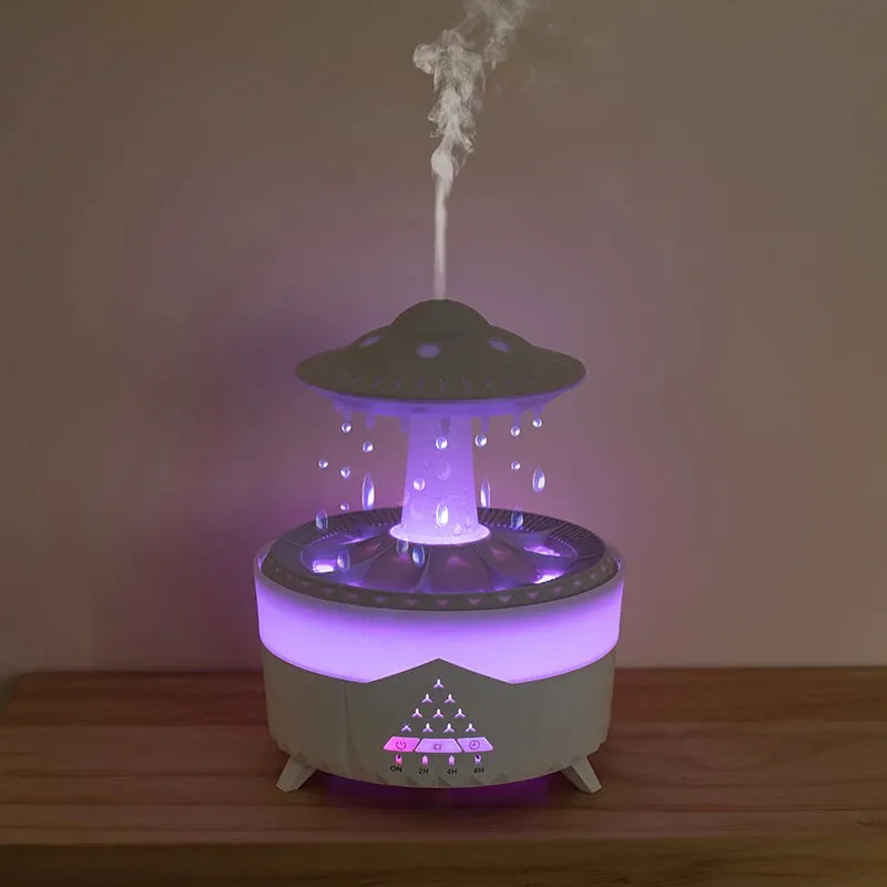 White UFO-shaped humidifier with water droplets creating mist and rain sounds