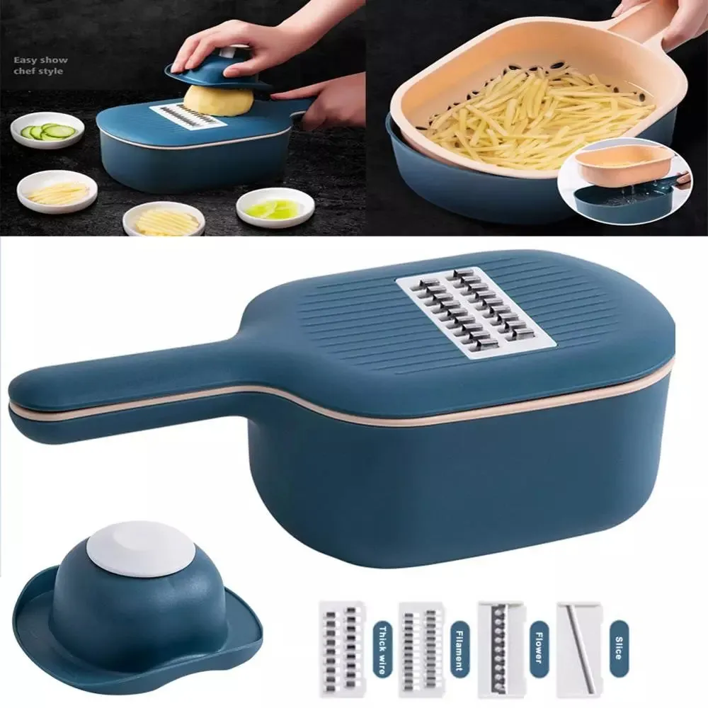 Dark blue vegetable cutter with four stainless steel blades, drain basket, and hand guard on a kitchen worktop