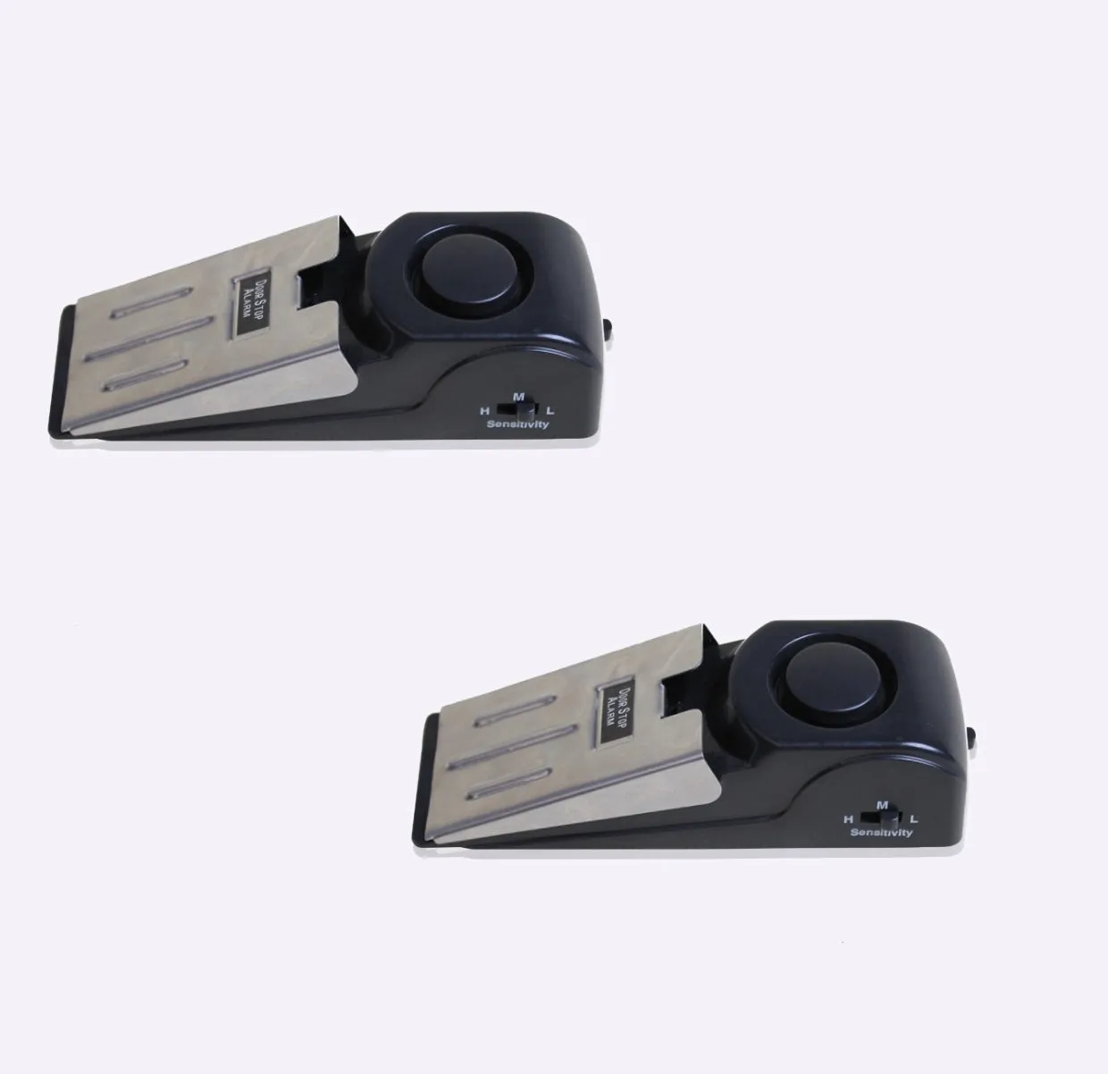Black portable door stop alarm with wedge shape and stainless steel sensor cover.