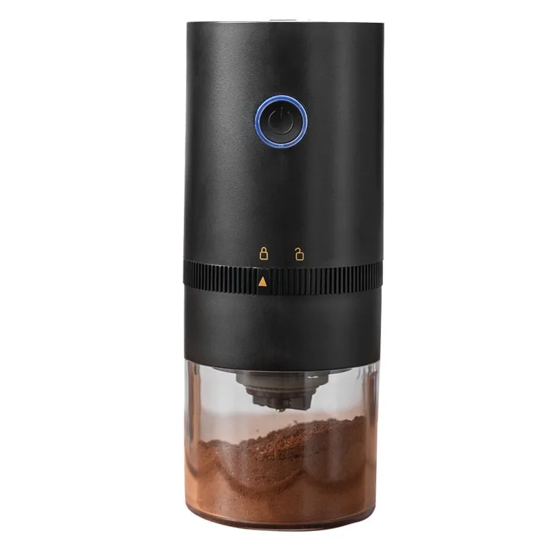 Black and white portable USB-C electric coffee grinder with transparent chamber on a kitchen counter