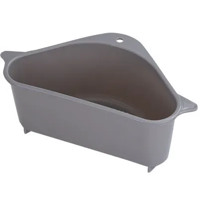 Beige and blue plastic triangle sink storage rack with suction cups holding a sponge