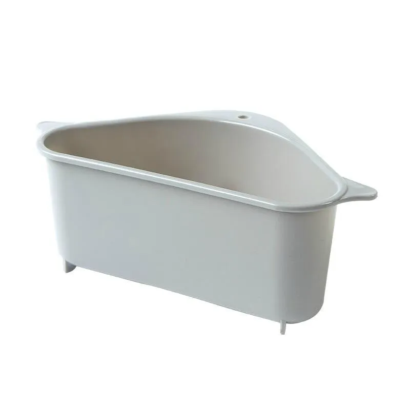 Beige and blue plastic triangle sink storage rack with suction cups holding a sponge