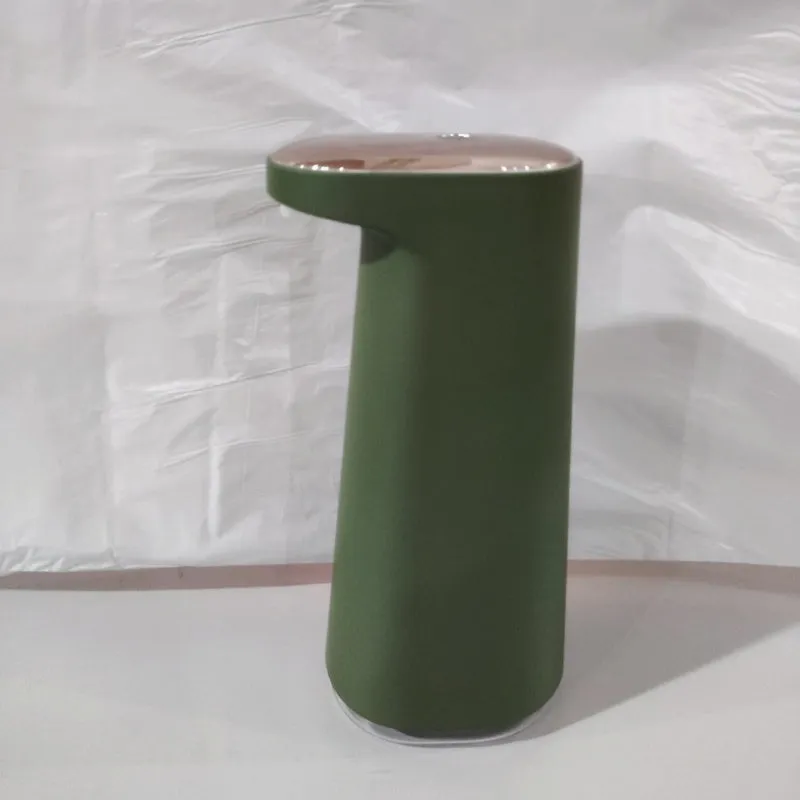 White automatic foam soap dispenser with sensor for touch-free operation on bathroom counter