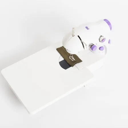 Miniature electric household sewing machine measuring 20 x 15 x 10 cm with straight stitch cylinder