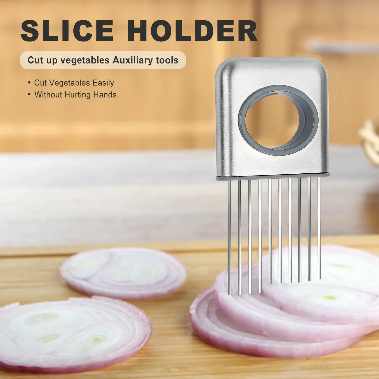 Stainless steel onion holder slicer with sharp prongs and a red finger guard on a cutting board.