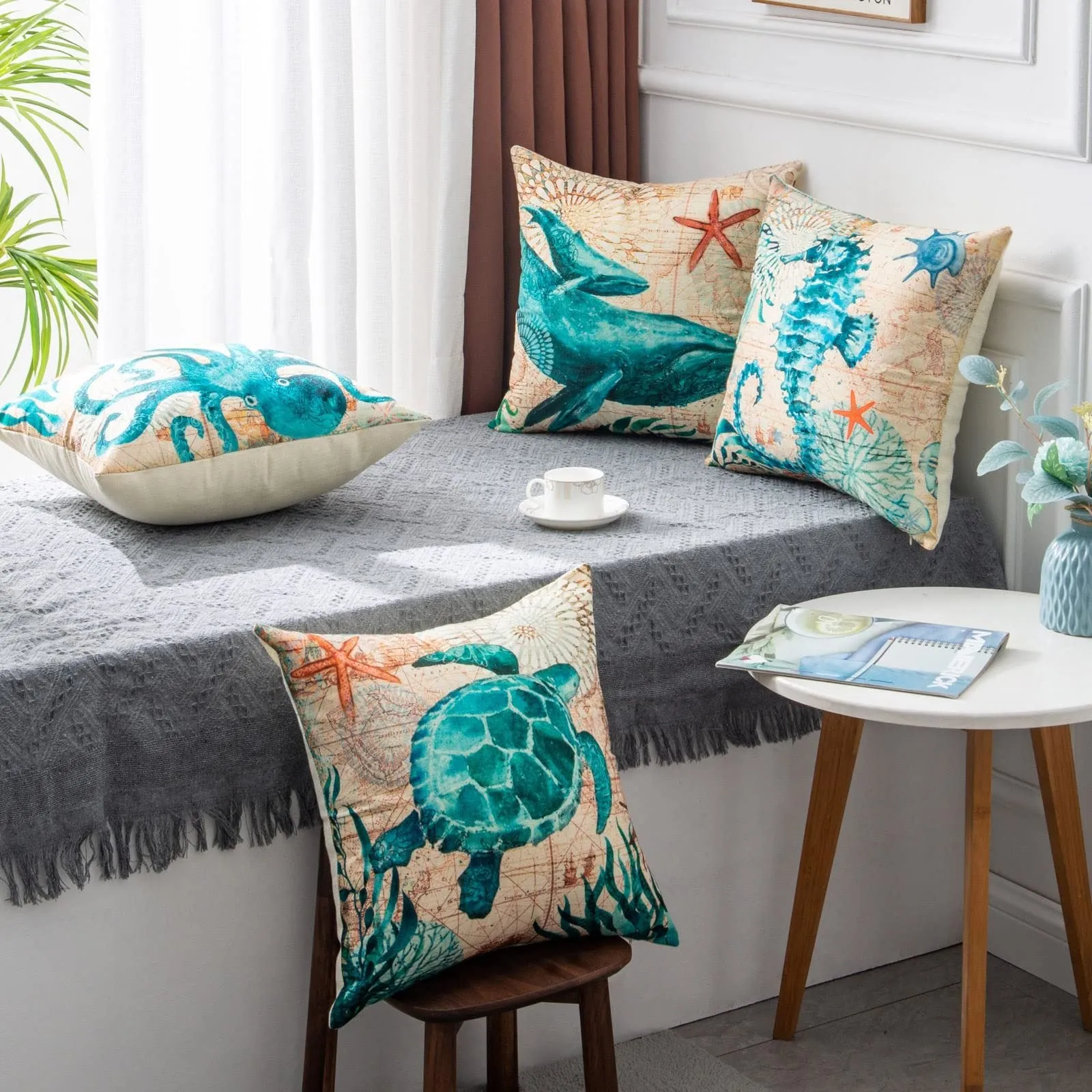 Square linen cushion cover with blue sea turtle print, showing invisible zipper closure.