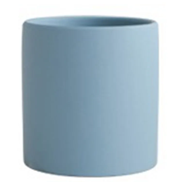 Cylindrical ceramic succulent planter with drainage hole in Nordic style, shown in a selected colour.