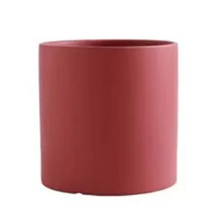 Cylindrical ceramic succulent planter with drainage hole in Nordic style, shown in a selected colour.