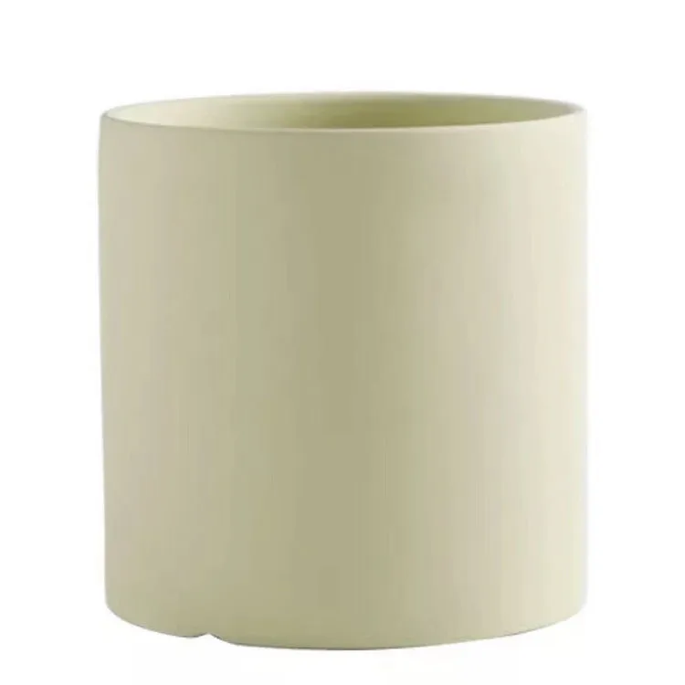 Cylindrical ceramic succulent planter with drainage hole in Nordic style, shown in a selected colour.
