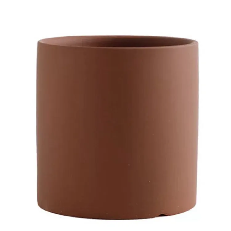 Cylindrical ceramic succulent planter with drainage hole in Nordic style, shown in a selected colour.