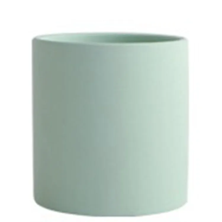Cylindrical ceramic succulent planter with drainage hole in Nordic style, shown in a selected colour.